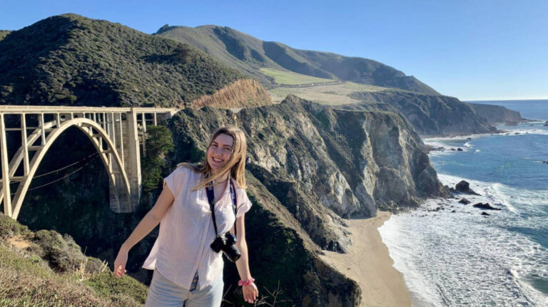 Author Laura McFarland standing in front of the Bixby Creek Bridge