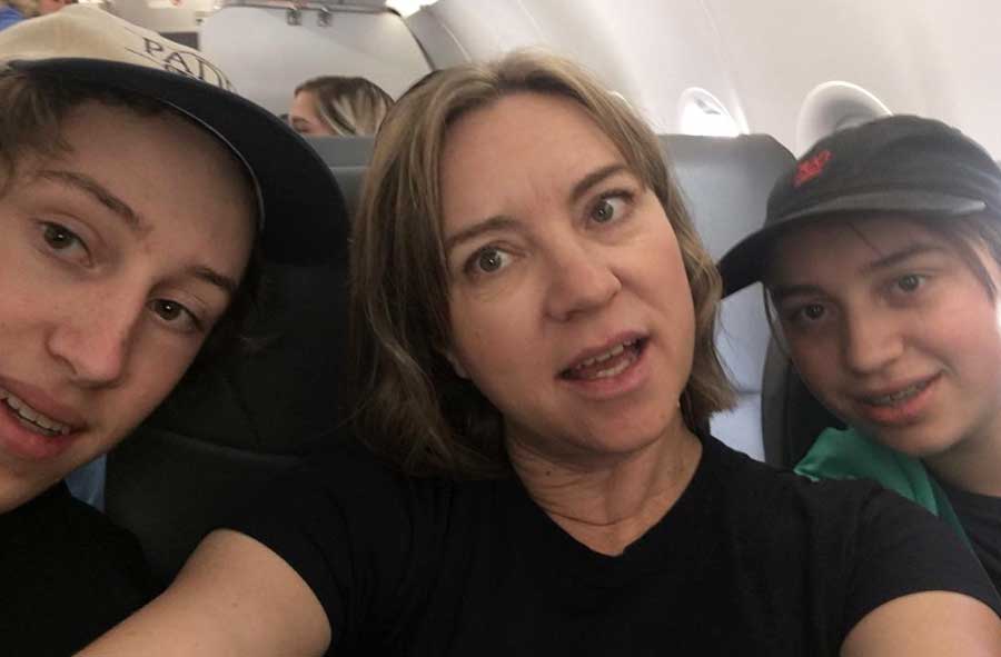 The author taking a selfie with her odder kids on her side
