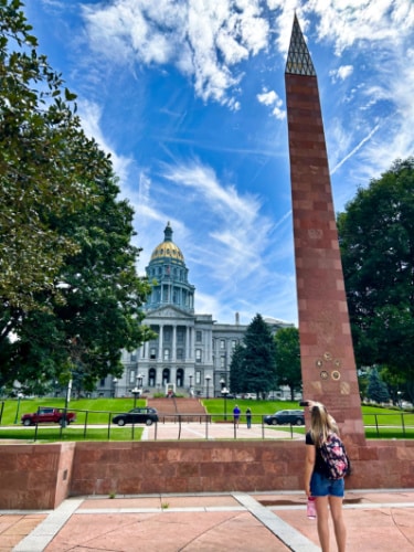 The author Laura Falin, taking a photo of the exterior of Colorado Capitol