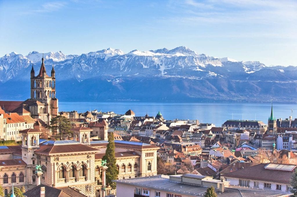 Aerial view of the cityscape of Lausanne with the Alps in the background