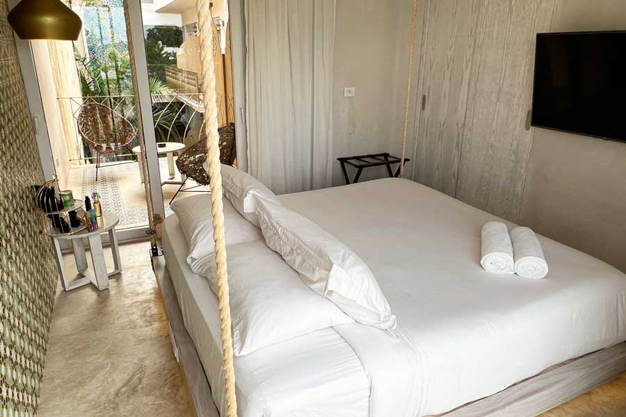 A bedroom with a television on it in Layla Tulum