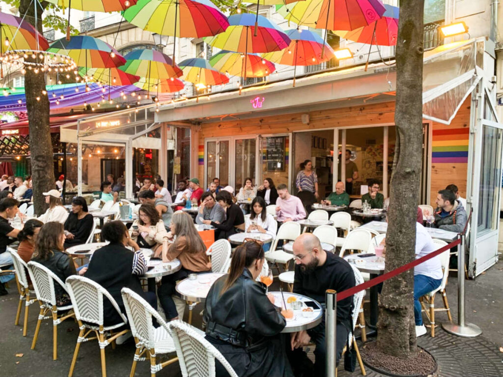 View of the crowd dining at the funky exterior of Le Ju'