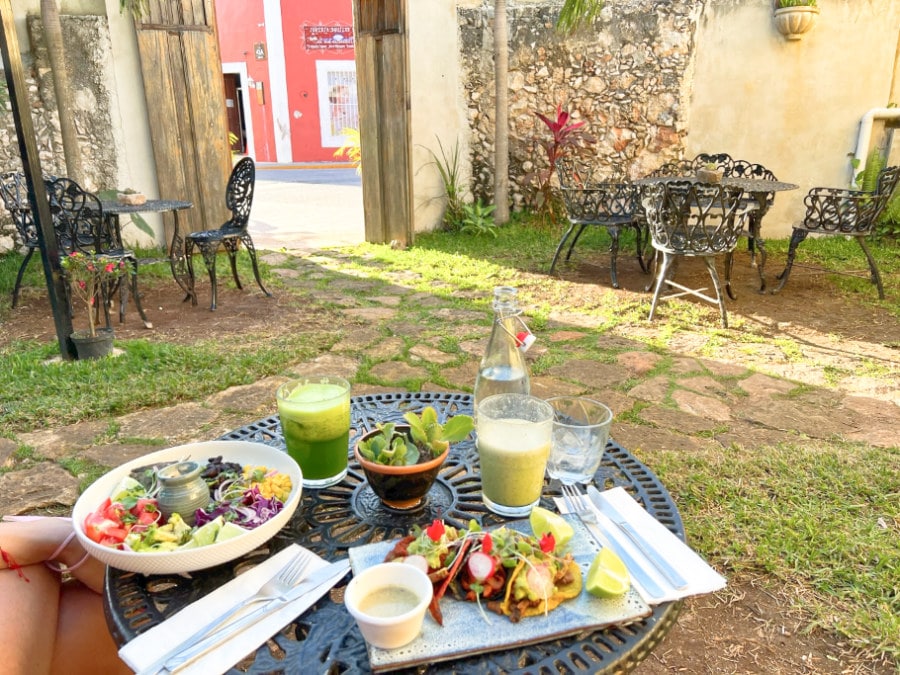 Food and courtyard at Le Kaat Vegetarian Restaurant