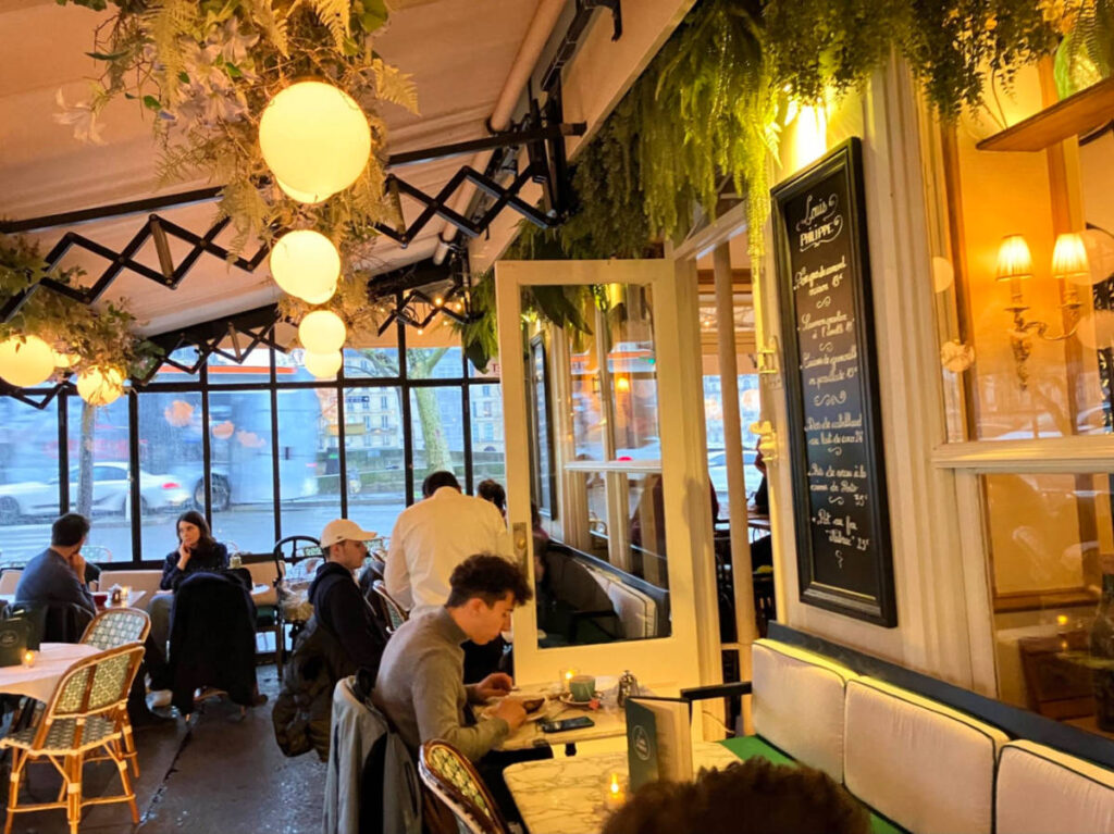 People dining at the cozy terrace at Louis Phillippe terrace