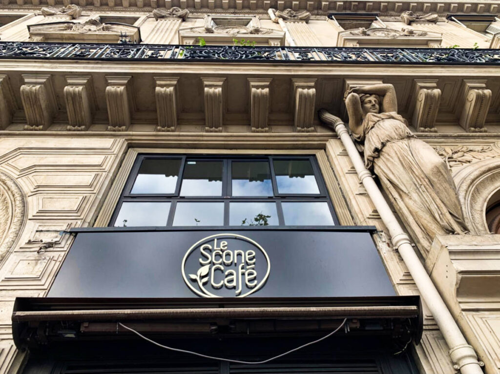 Le Scone Café's logo on the awning with a beautiful exterior