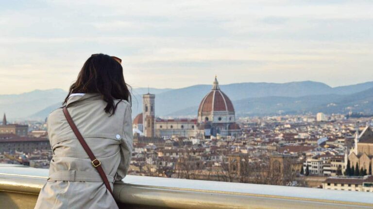 The author Lea Rose Allbaugh overlooking the scenic view of the European city