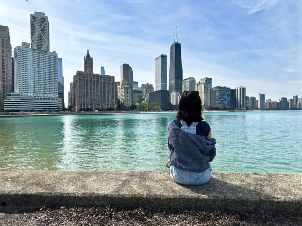 The author Lea Rose Allbaugh admiring the Chicago skyline from Milton Lee Olive Park