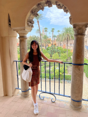 Travel Lemming Editor, Lea Rose Allbaugh, posing for a photo at the Royal Alcázar of Seville