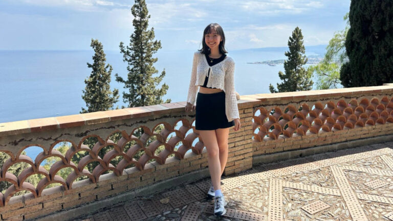 The author, Lea Rose Allbaugh smiling for a photo at Villa Comunale di Taormina