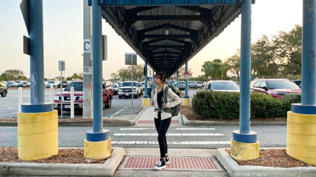 The author Lea Rose posing at the shed near the airports parking area