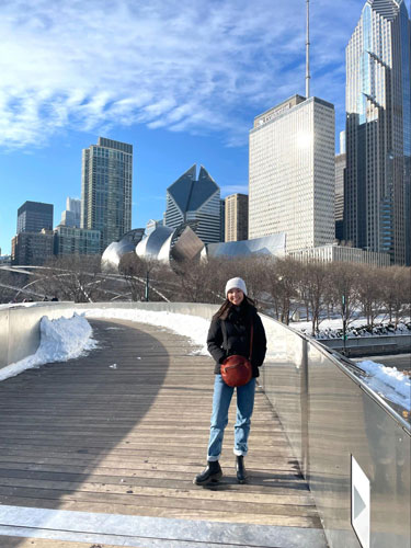 Lea Rose Allbaugh with skyscrapers in Chicago, Illinois on he background