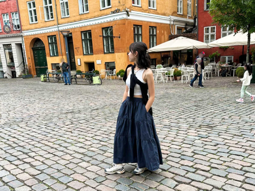The author Lea Rose Allbaugh, posing for a photo in the middle of the street