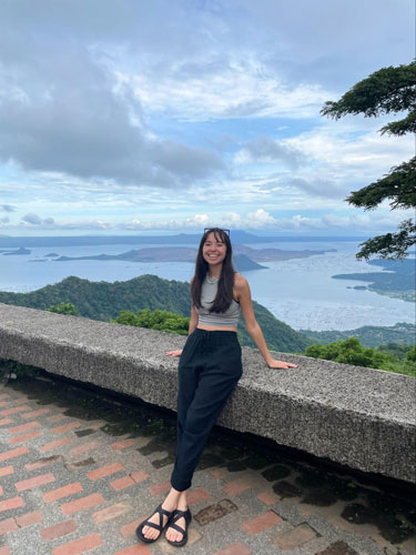 Lea Rose Allbaugh with the Taal Volcano on her background in Tagaytay, Philippines