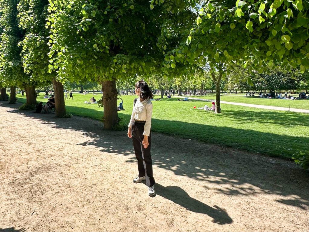 The author Lea Rose Allbaugh, posing for a photo at the park in Copenhagen