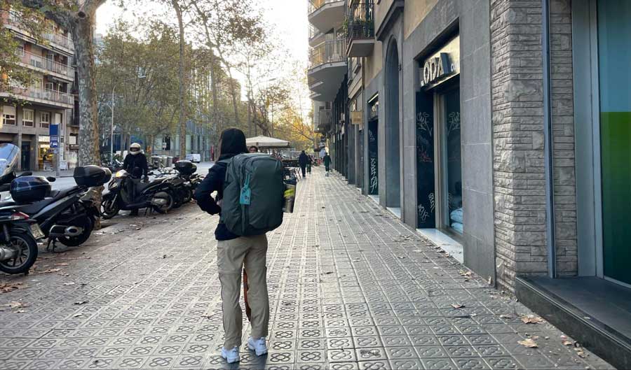 The author carrying her backpack on a street