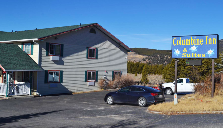 View of the Columbine Inn and Suites and the cars parked outside it