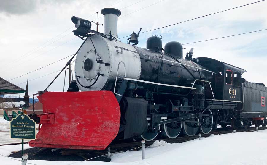 View of a historic locomotive park in the Leadville Railroad Parking