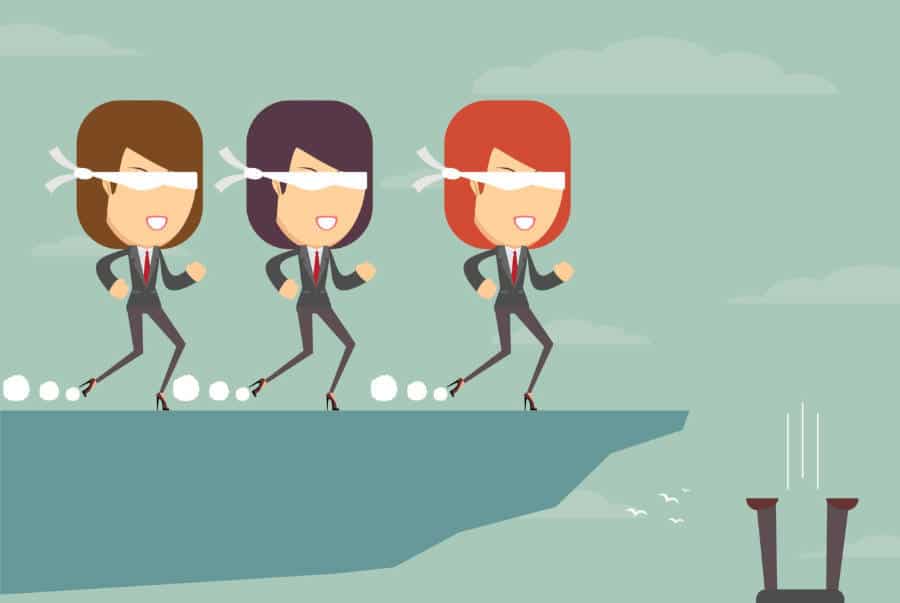 Blindfolded people walking towards a cliff