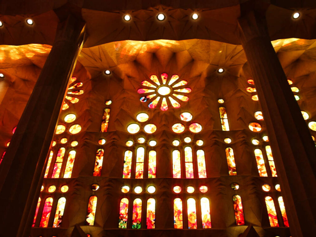 Picturesque view of the light coming through the stained glass windows of La Sagrada Familia