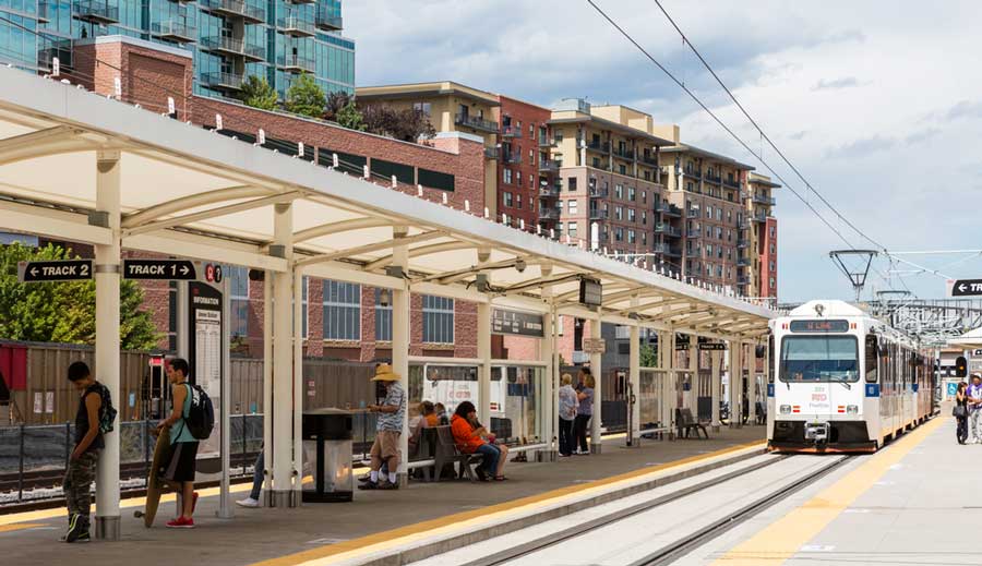 People waiting for a train in lightrail statio