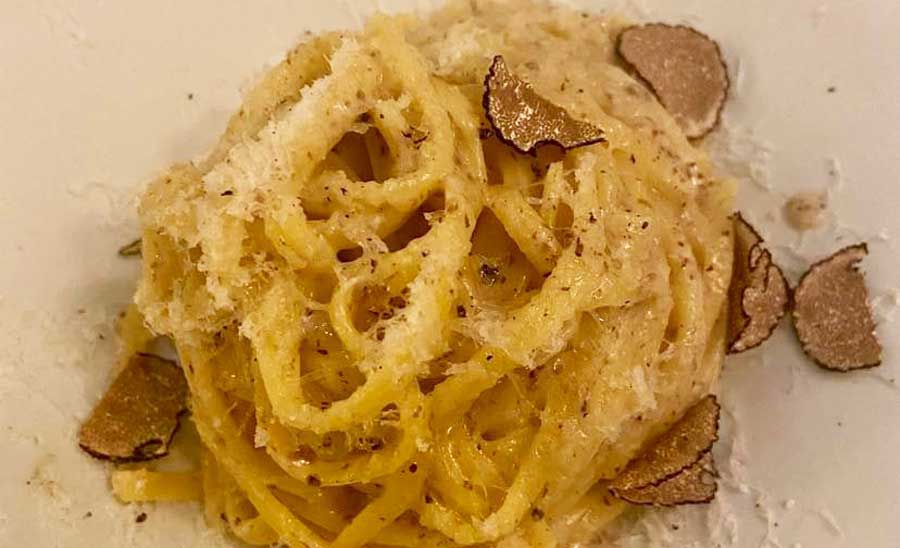 A truffle pasta on a plate in Lina Stores