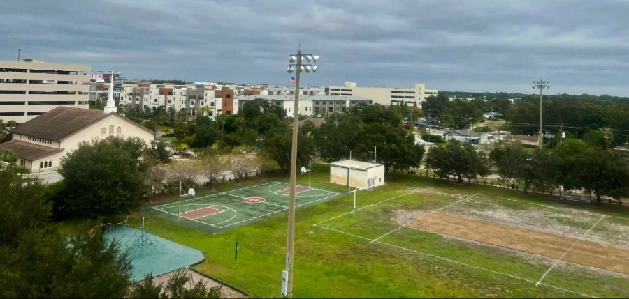 Overlooking view of apartment complexes and field of Lincoln Gardens Park in Westshore on a cloudy day