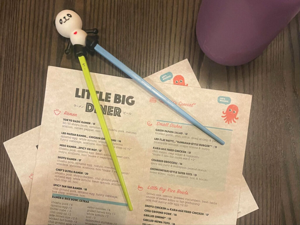 Colorful chopsticks and the menu at Little Big Diner