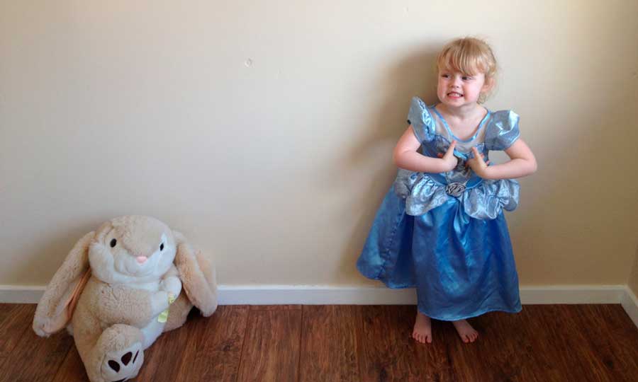 A little girl dressed like a Disney Princess