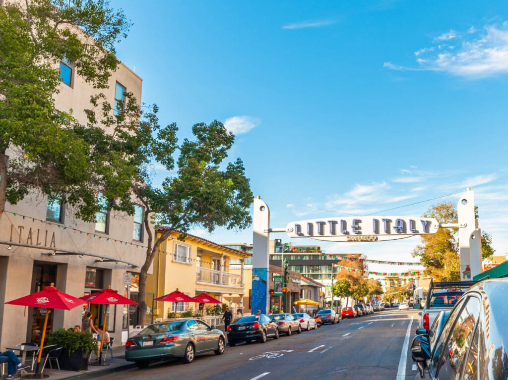 View of the welcome arch sign of Little Italy over the street