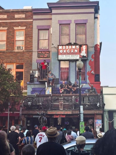 View of the crowd watching the live band at the balcony of Madam’s Organ