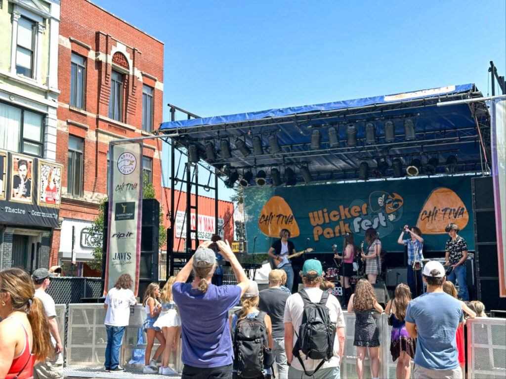 The crowd watching the live performance on the stage at Wicker Park Fest