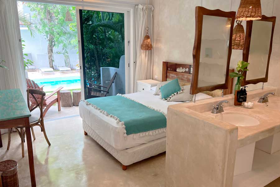 View of the pool from the bedroom in Live Tulum