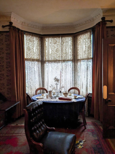 View of the preserved dining and living room of Tenement House