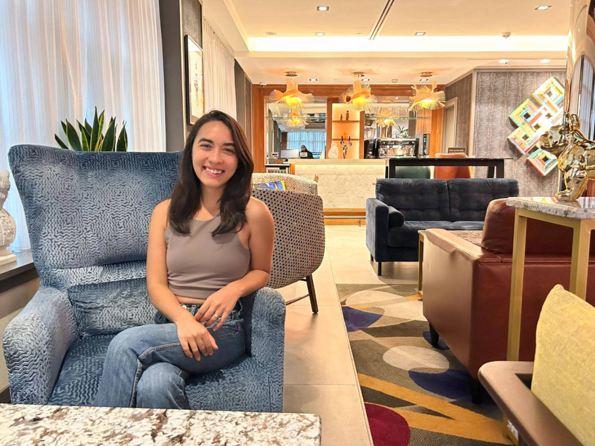 Abigail Bliss sitting at the lobby area in NYX Hotel Dublin Christchurch