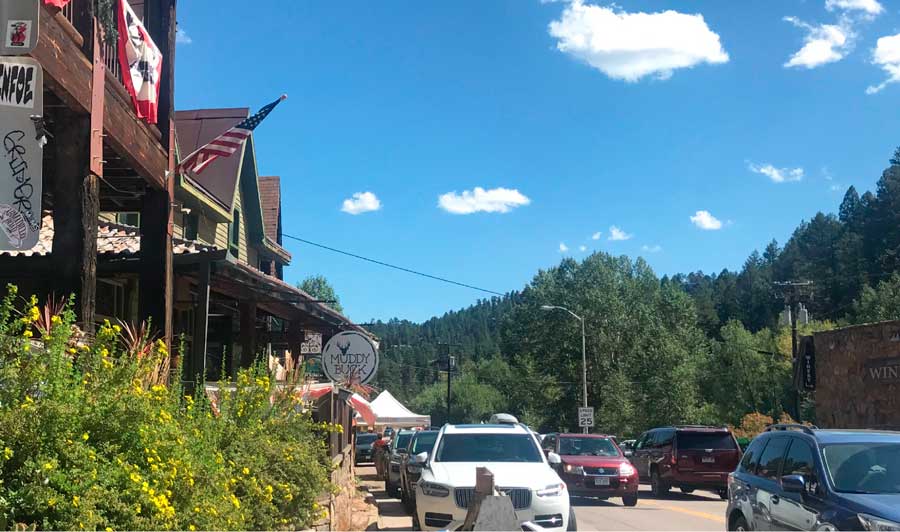 Cars parked outside the local shops in Downtown Evergreen