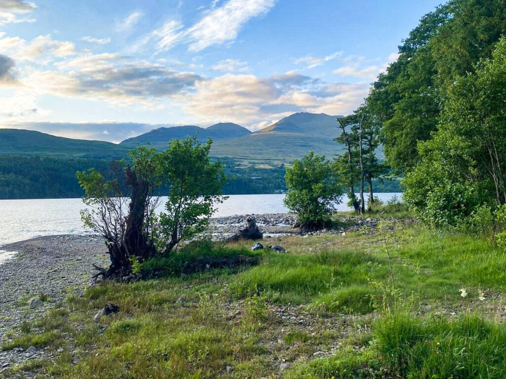 Scenic view of the mountain and the greenery from the shore of Loch Tay