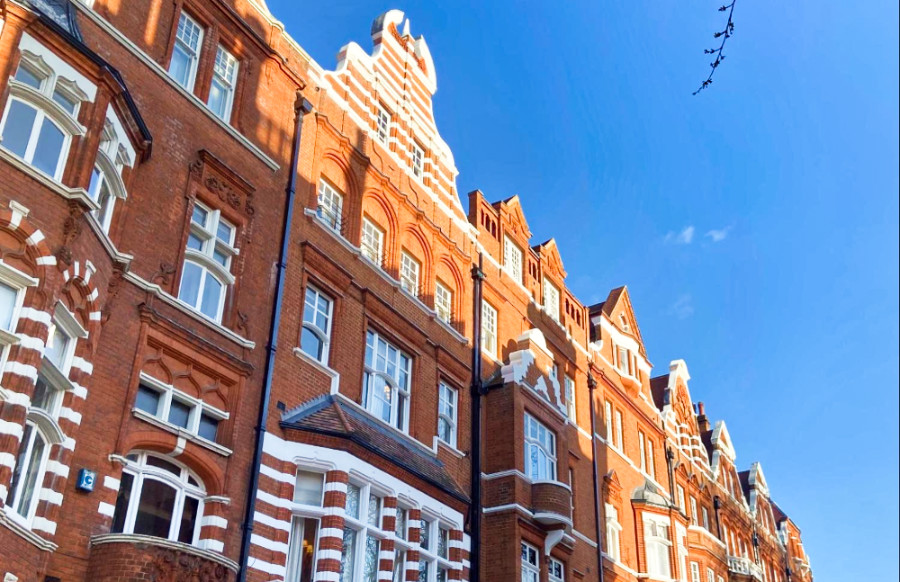 View of the red and white brick exterior of a building in London