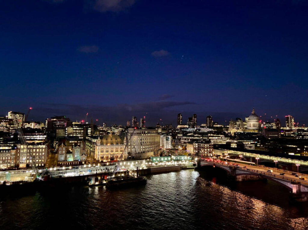 Buildings with lights at night in London