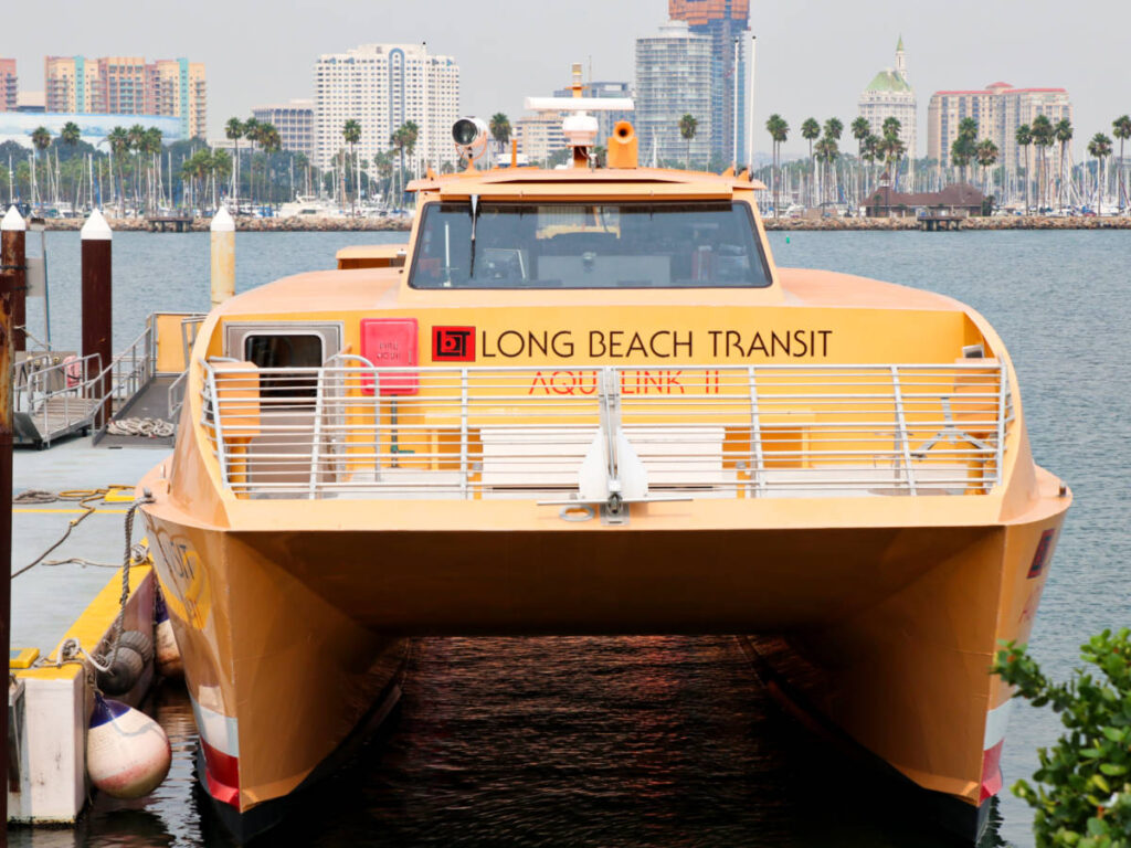 View of the bright yellow Long Beach Transit Aqua Link II on the water