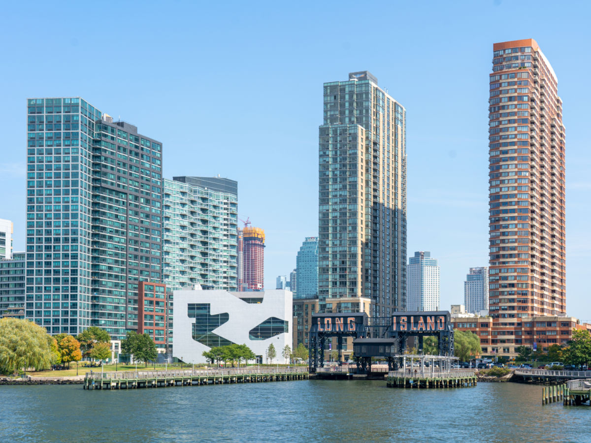 Pier at Gantry Plaza State Park and buildings with blue sky