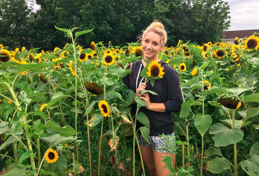 The author in the sunflower field in Long Island