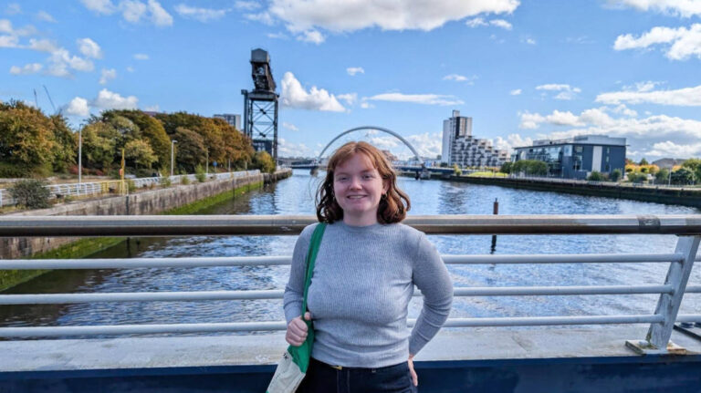 The author, Louise Wylie, smiling for a photo at the River Clyde