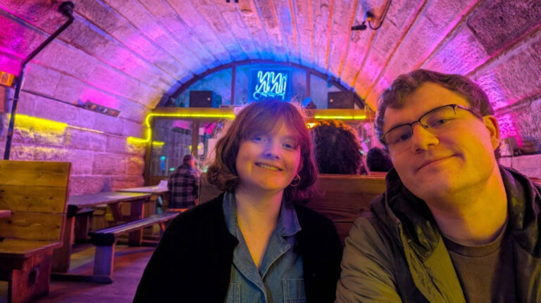 The author and her partner posing for a photo inside the West End’s Inn Deep pub