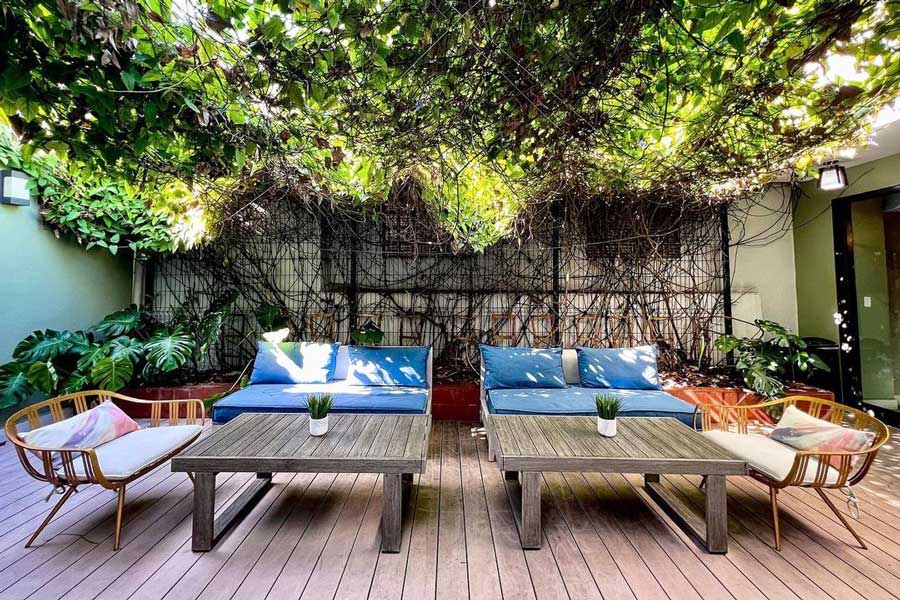 View of sofa and tables outside the Trópica Beach Hotel