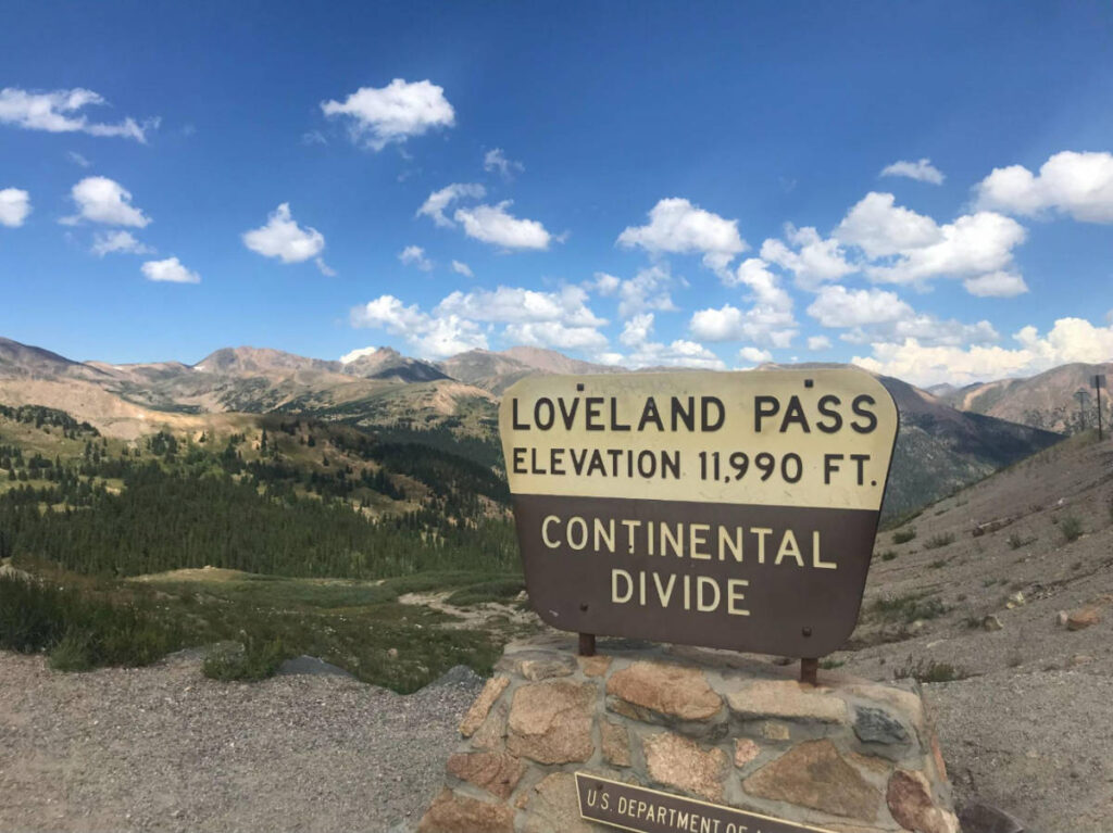Blue sky over the signage of Loveland Pass