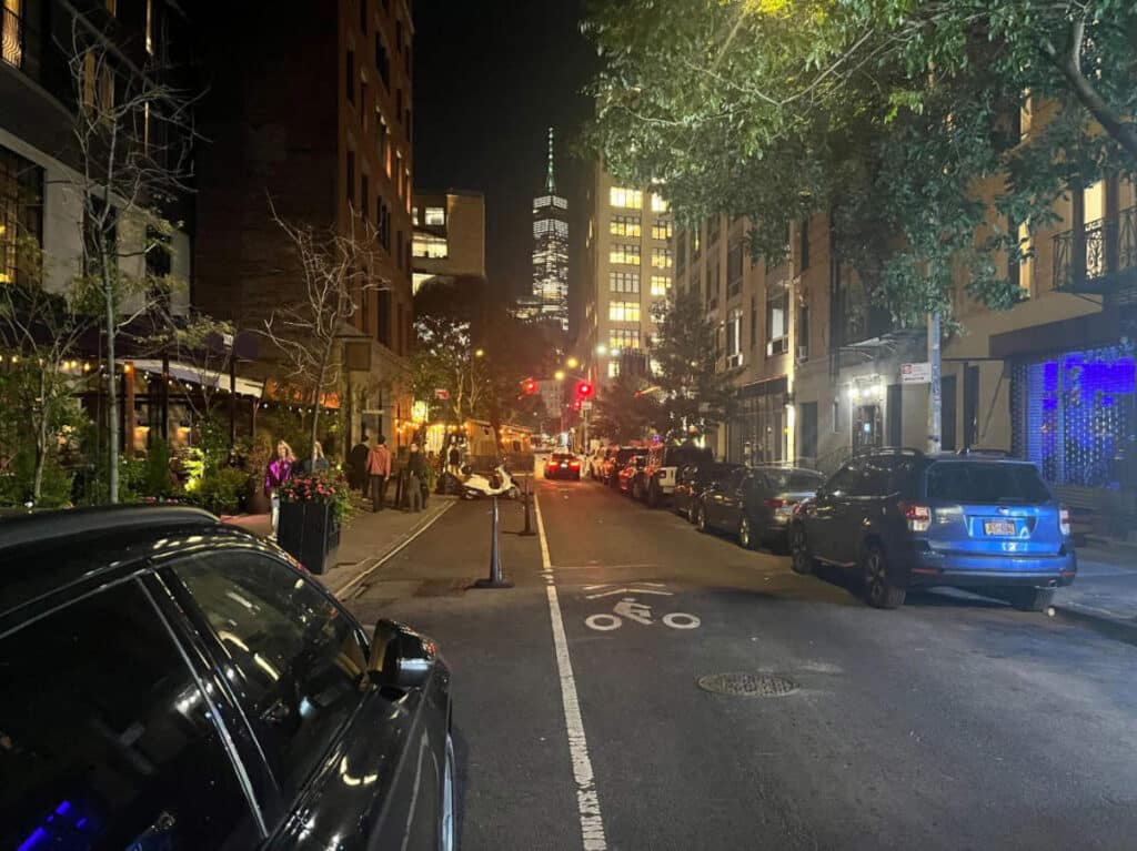 Cars parked on a street in Lower Manhattan at night