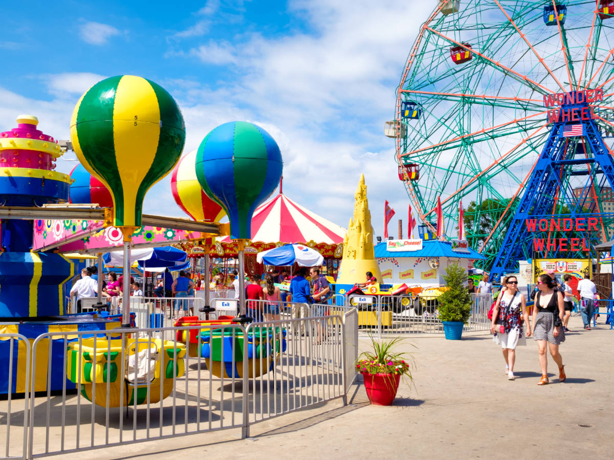 People enjoying different attractions at Luna Park in Coney Island