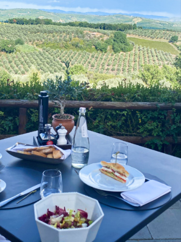 Variety of food on the table with an overlooking view at COMO Castello de Nero