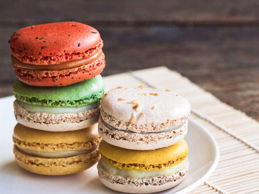 A plate of stacked colorful macarons