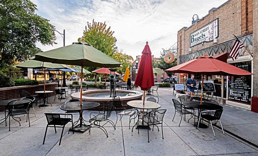 Tables and chairs outside the Main Street Bagels